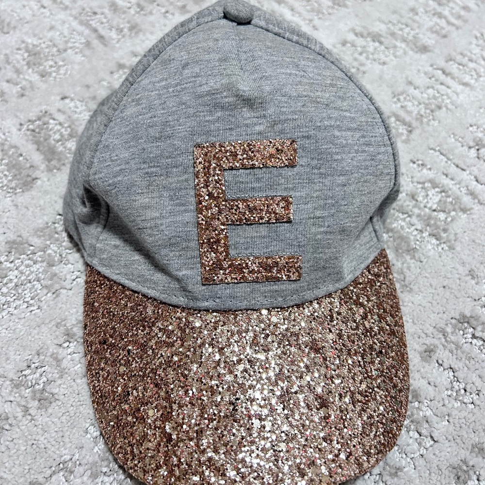Gold letter E Justice hat